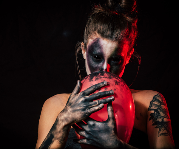 girl holding balloon